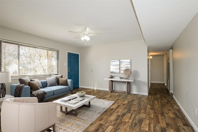 living room featuring ceiling fan, dark hardwood / wood-style flooring, and a wealth of natural light