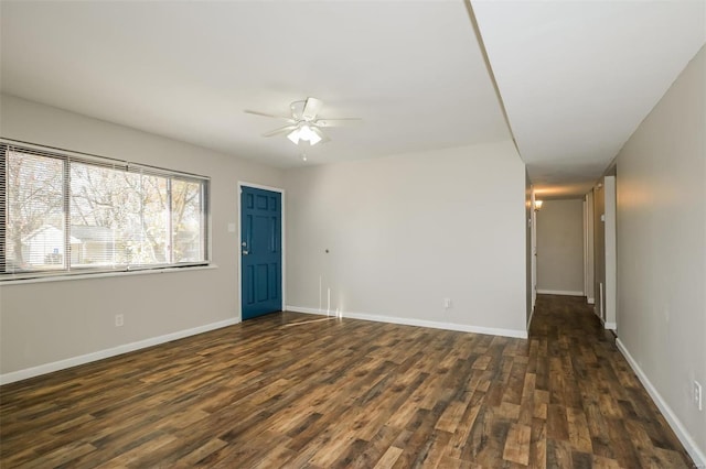 unfurnished room with dark hardwood / wood-style floors and ceiling fan