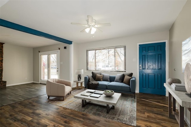 living room with a wealth of natural light, ceiling fan, and dark hardwood / wood-style floors