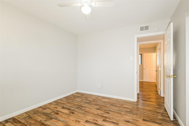 spare room with ceiling fan and wood-type flooring