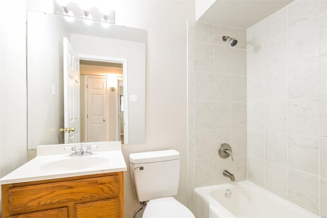 full bathroom with vanity, toilet, and tiled shower / bath