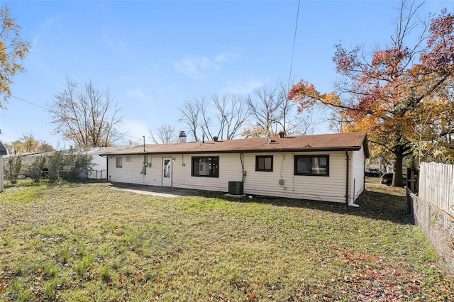 back of house featuring a patio area, a yard, and cooling unit