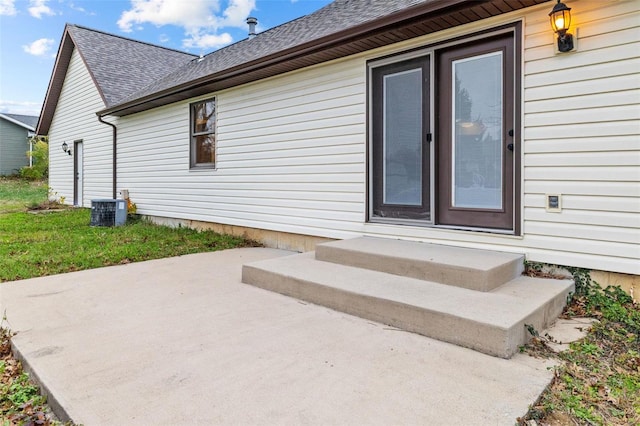 exterior space with a patio and cooling unit