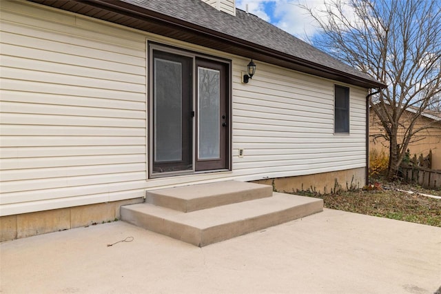 entrance to property with a patio