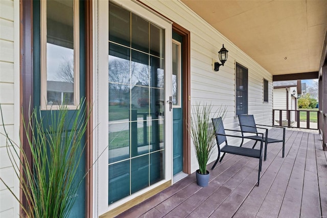 wooden terrace featuring a porch