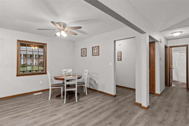 dining room featuring ceiling fan and light wood-type flooring