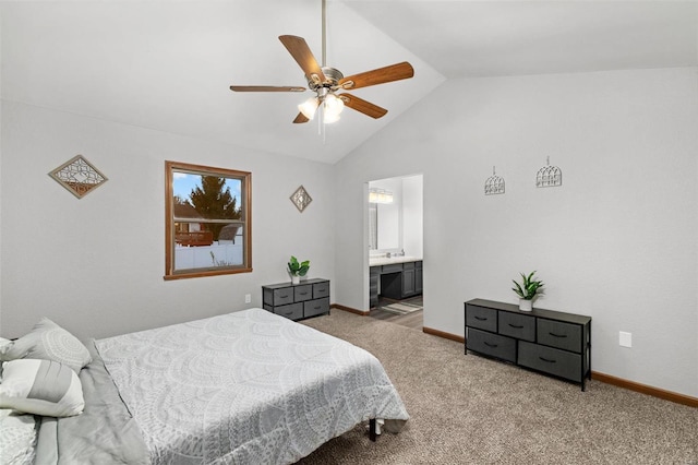 carpeted bedroom with ceiling fan, high vaulted ceiling, and ensuite bathroom