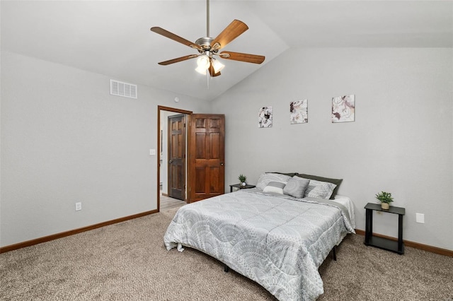 bedroom with ceiling fan, lofted ceiling, and carpet floors