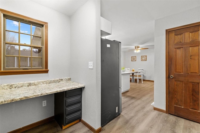 interior space with hardwood / wood-style floors and ceiling fan