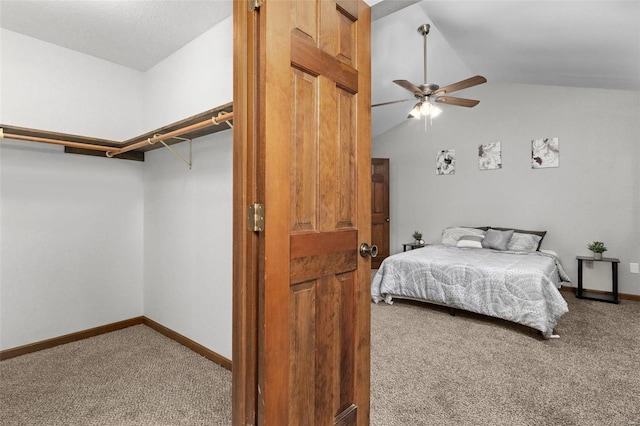 bedroom featuring ceiling fan, lofted ceiling, and carpet floors