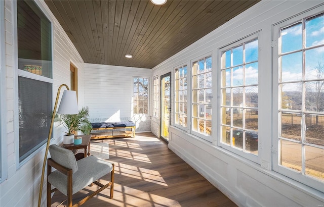 sunroom featuring wooden ceiling