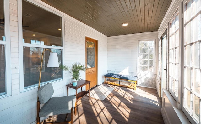 sunroom / solarium featuring wooden ceiling