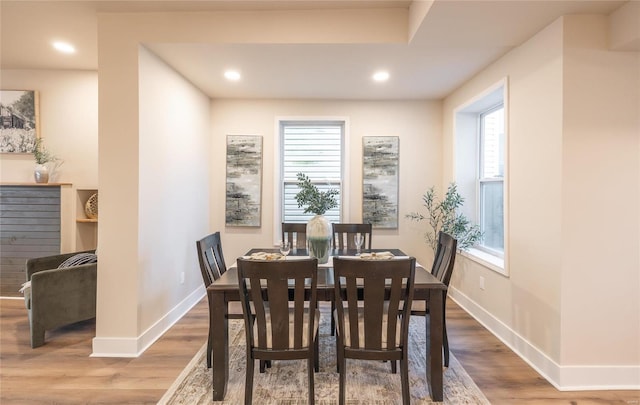 dining area with hardwood / wood-style floors and a wealth of natural light