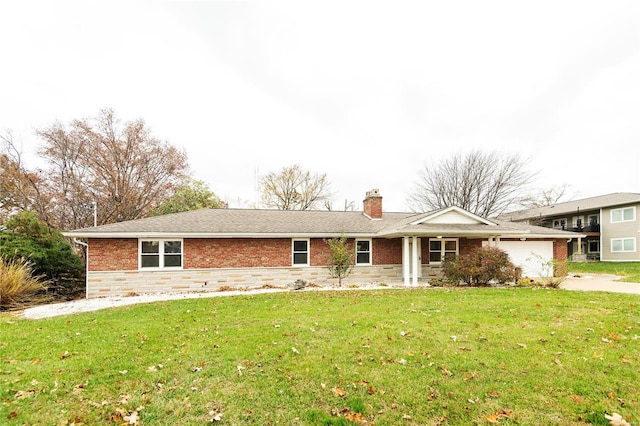 ranch-style home featuring a front lawn and a garage