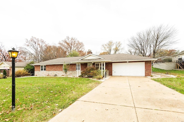 single story home featuring a front yard and a garage