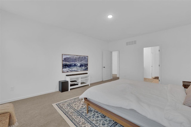 bedroom featuring light carpet