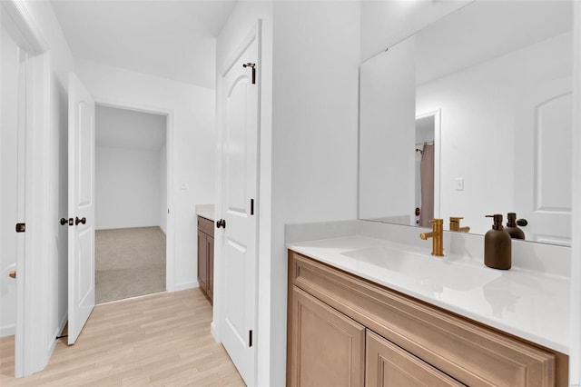 bathroom with vanity and wood-type flooring