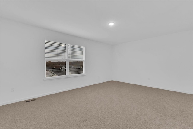 unfurnished room with carpet flooring