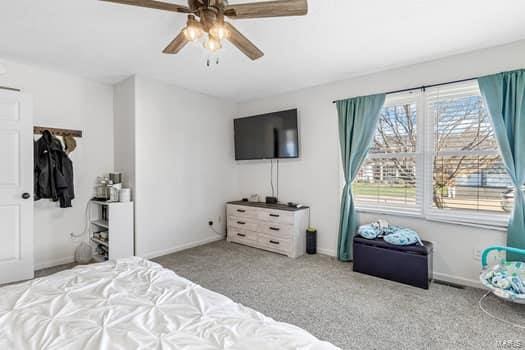 carpeted bedroom featuring ceiling fan