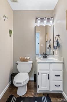 bathroom with vanity and toilet