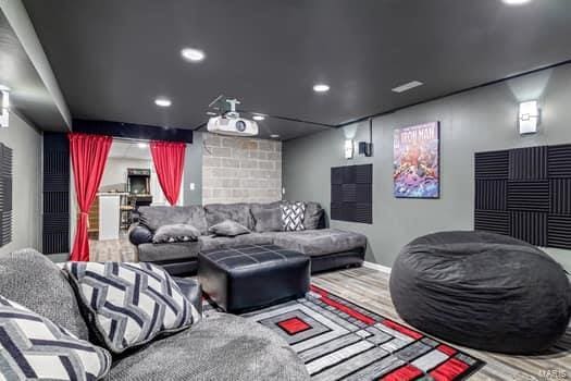 home theater room with hardwood / wood-style flooring