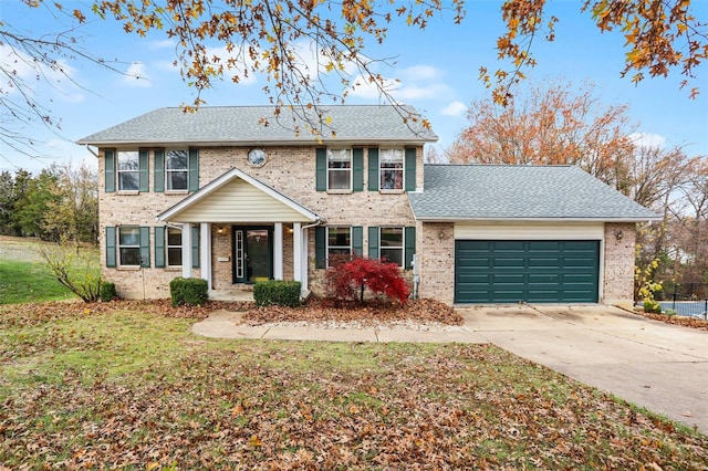 colonial inspired home featuring a garage