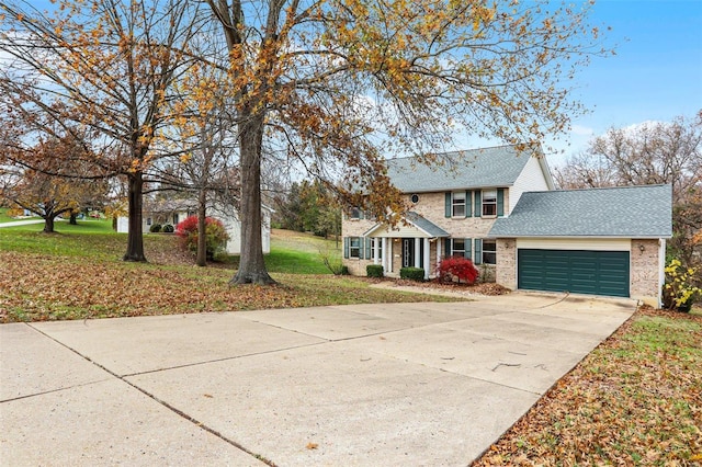 view of front of house with a garage and a front lawn