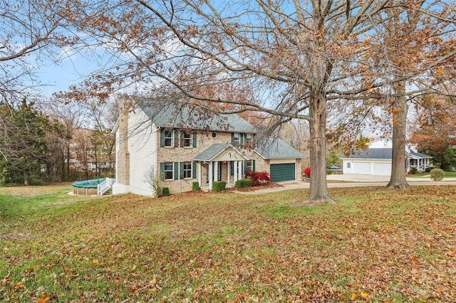 view of front facade featuring a front lawn and a garage