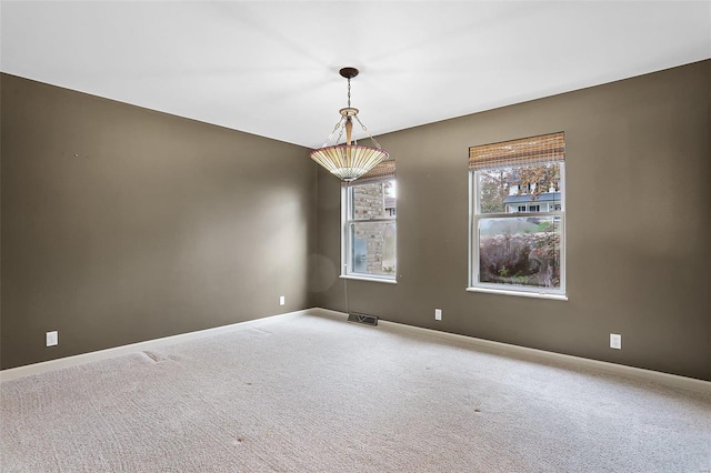 unfurnished room with carpet flooring