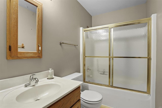 full bathroom featuring vanity, enclosed tub / shower combo, and toilet