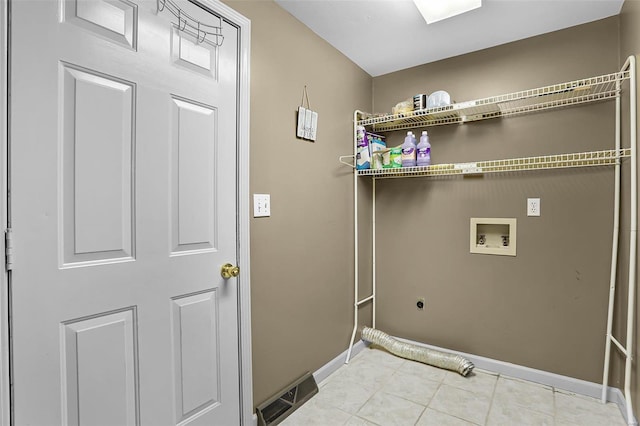 laundry area with electric dryer hookup, light tile patterned floors, and hookup for a washing machine