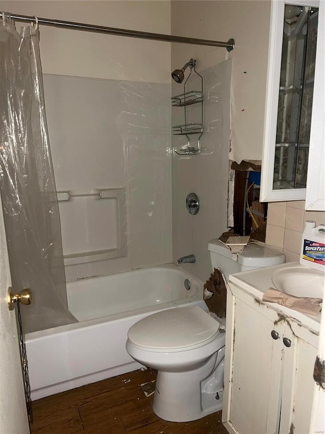 full bathroom with shower / bath combo, toilet, wood-type flooring, and vanity