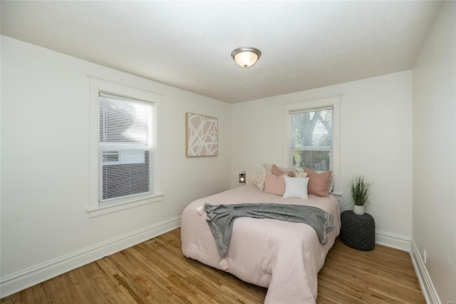 bedroom with hardwood / wood-style flooring