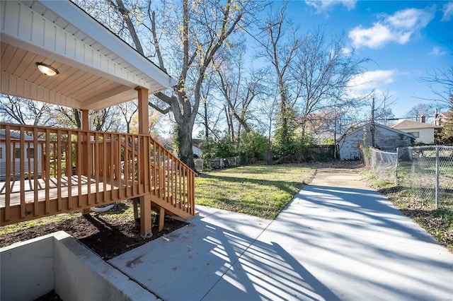 wooden deck featuring a yard and a patio area