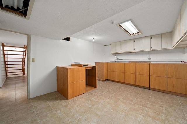 kitchen featuring a textured ceiling