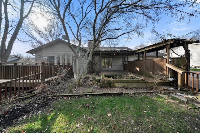 rear view of house with a patio and a deck