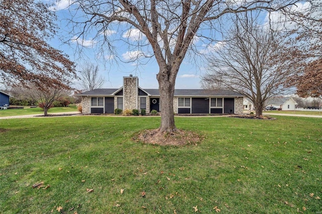 ranch-style home with a front yard