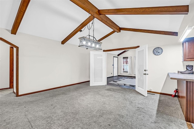 unfurnished living room with carpet flooring, vaulted ceiling with beams, and a chandelier