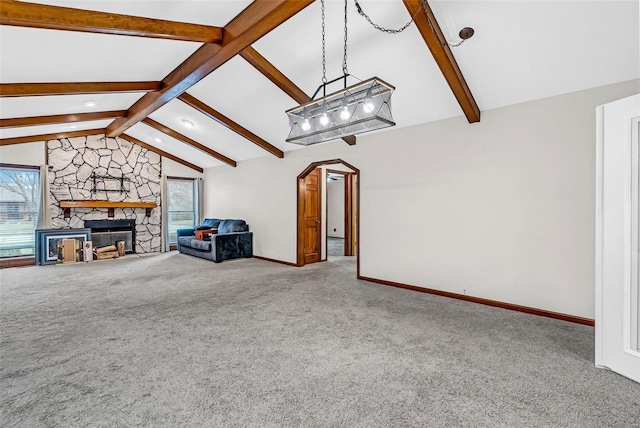 unfurnished living room featuring carpet flooring, a wealth of natural light, and a fireplace