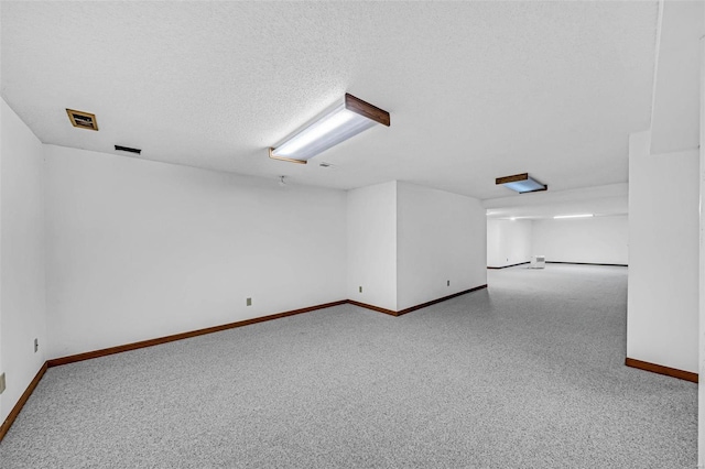 unfurnished room featuring a textured ceiling