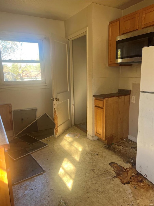 kitchen featuring white fridge