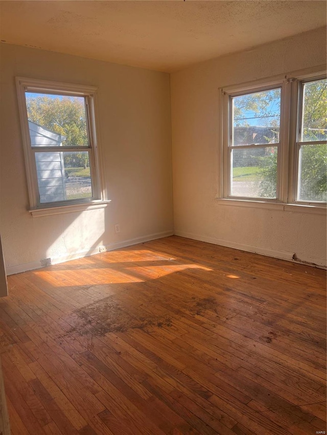 empty room with dark hardwood / wood-style floors