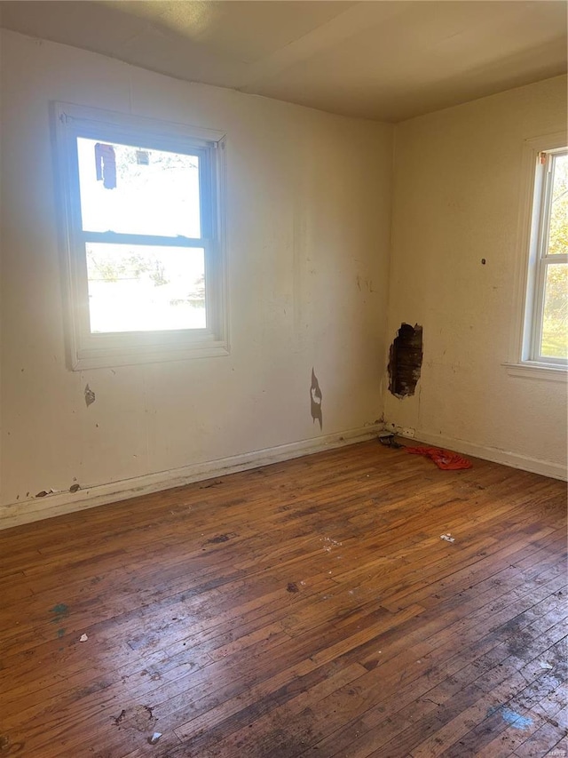 empty room with dark hardwood / wood-style floors