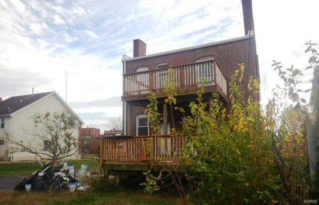 back of house featuring a deck