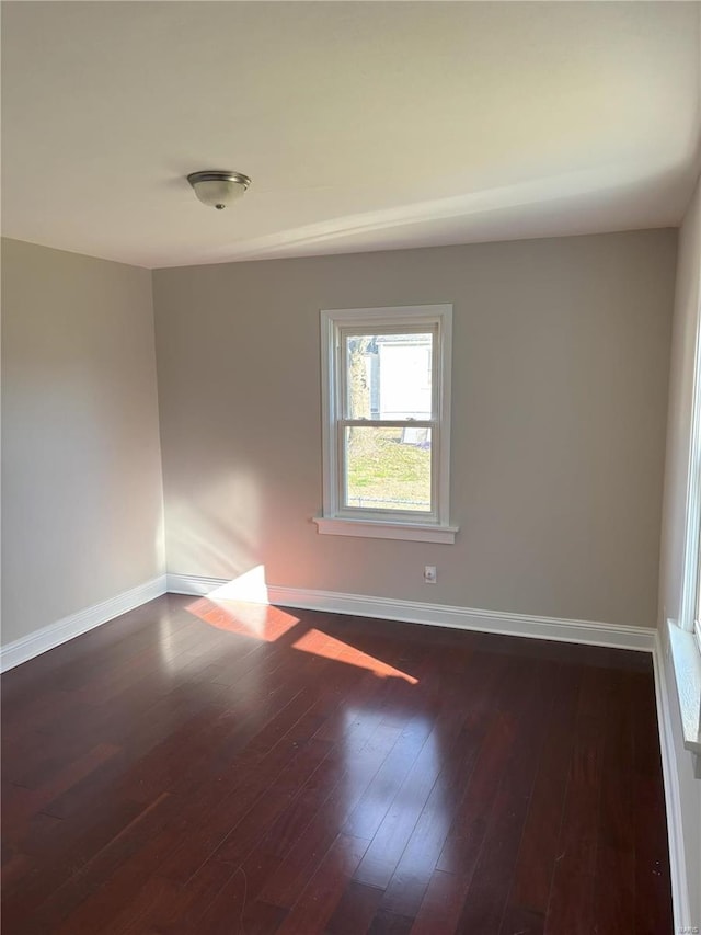 empty room featuring dark hardwood / wood-style floors