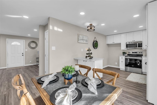 dining room with hardwood / wood-style floors