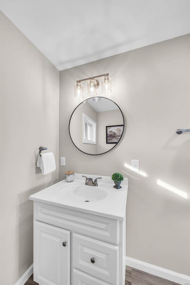 bathroom with vanity and wood-type flooring