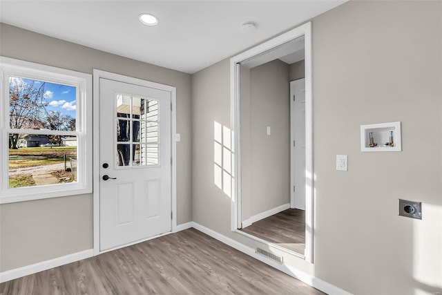 doorway to outside with light hardwood / wood-style floors