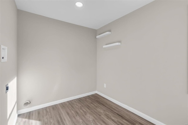 interior space featuring hookup for an electric dryer and hardwood / wood-style floors