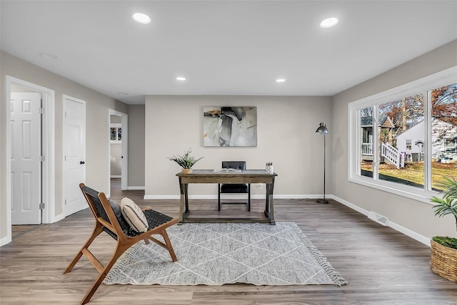 office space with hardwood / wood-style floors